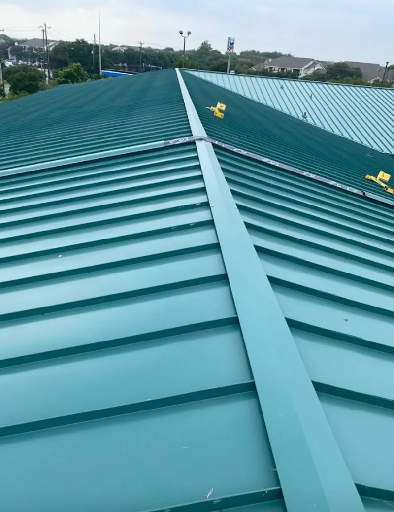 Green commercial metal roof ridge and valley for Metal Roof Repair in Somerville